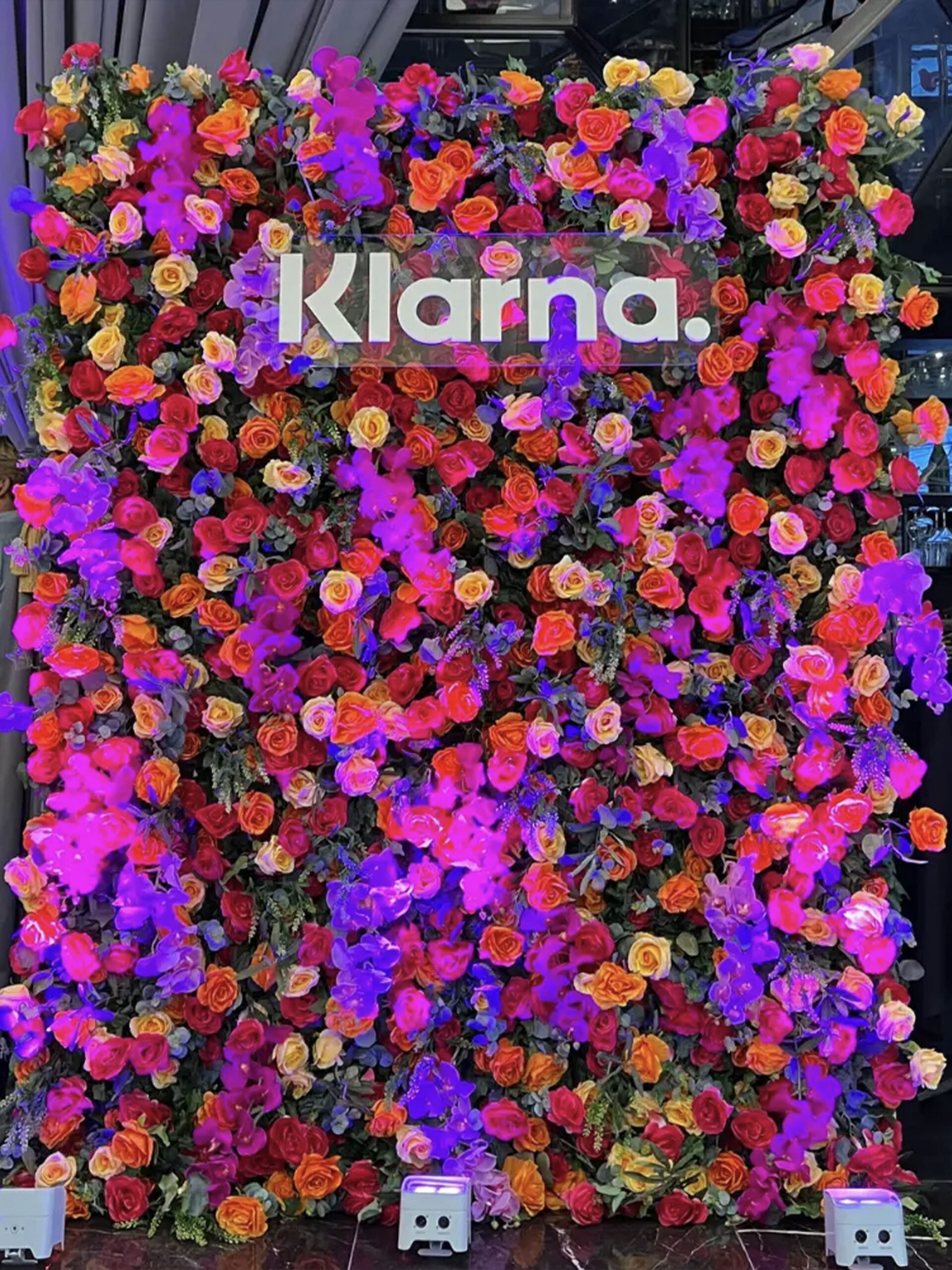 Corporate flower wall rental with uplighting