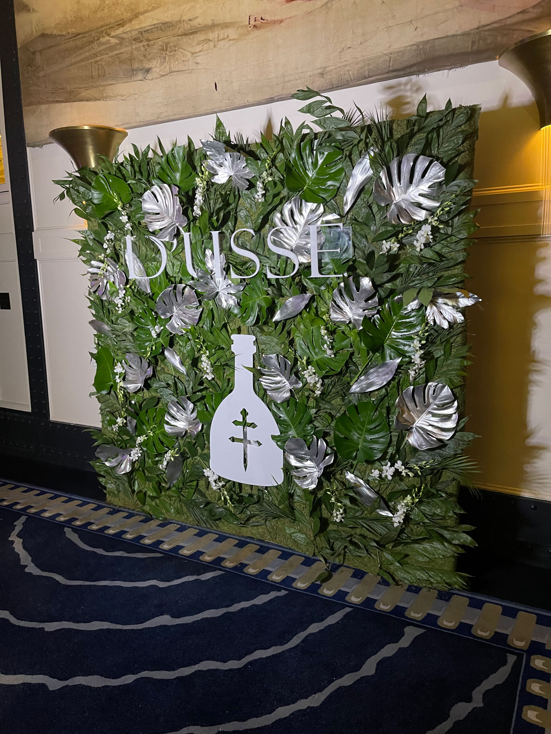 Custom flower wall rental with custom signage